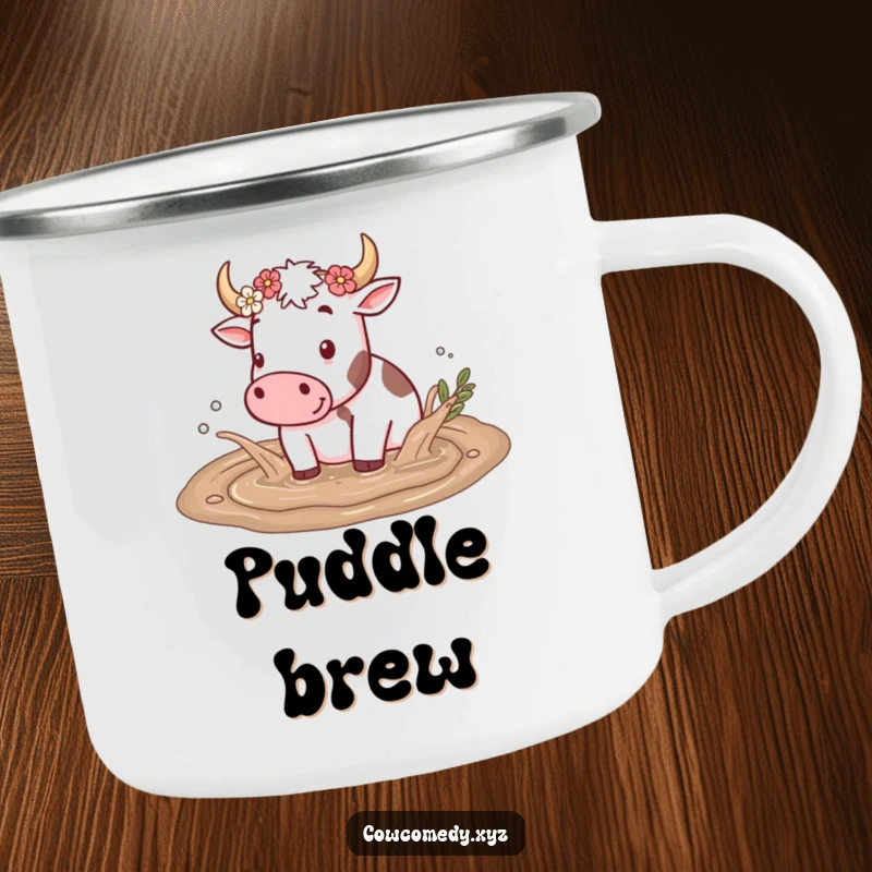 Funny camping mug with a cow splashing in a mud puddle, flowers on horns, designed for outdoor enthusiasts who love country charm.