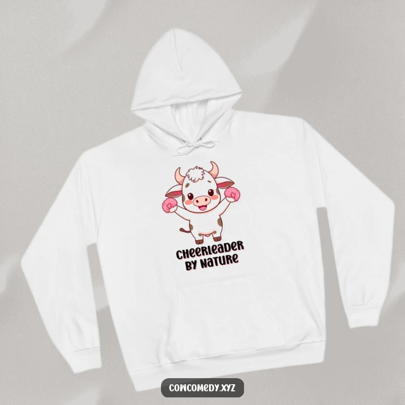 Funny Kawaii Cow Hoodie: Features an adorable, cheering Kawaii cow with pom-poms on a warm hoodie, embodying spirit and comfort for a great gift.