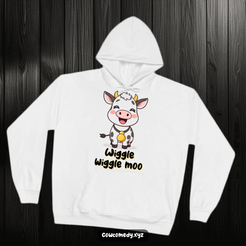 Funny cow with a bell around its neck wiggles joyfully, depicted on this cozy and amusing hoodie.