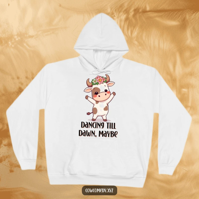 Funny cow in a flower crown, performing a silly dance, on a warm hoodie, for comfortable and humorous casual wear.
