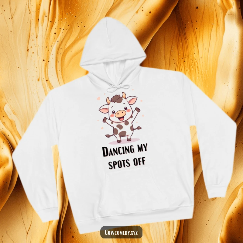 Funny Kawaii cow doing a happy dance, spots flying off, on a warm, cozy hoodie, perfect for chill.