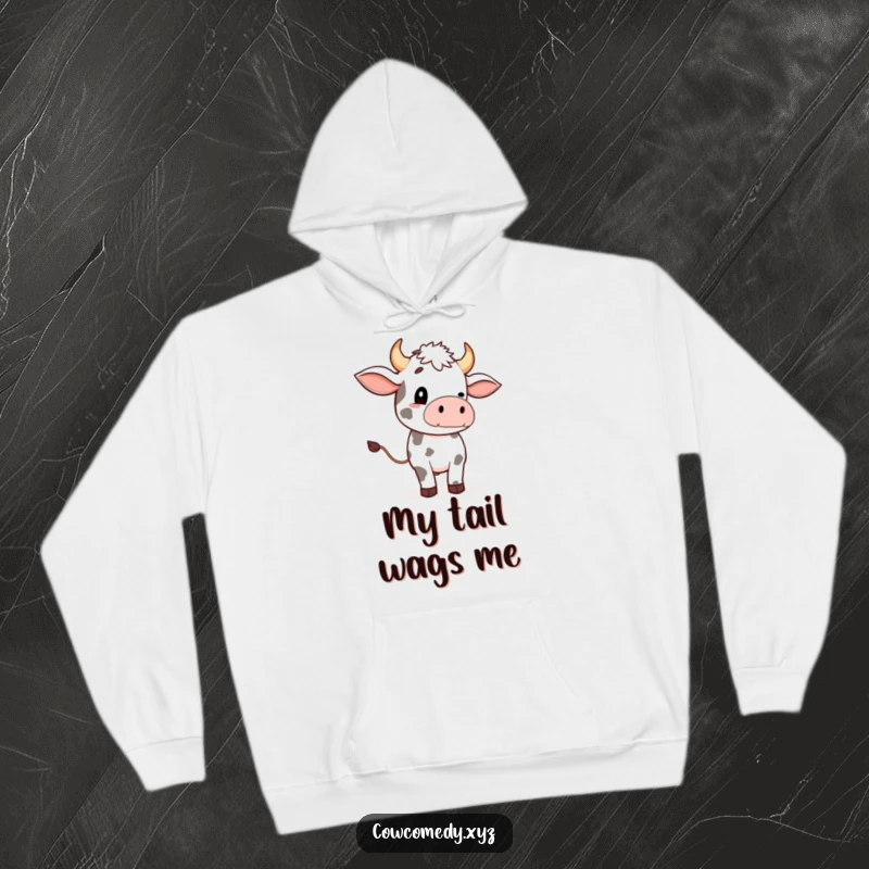 Funny hoodie with a charming cow character doing a comical, oversized tail wave, perfect for animal lovers.