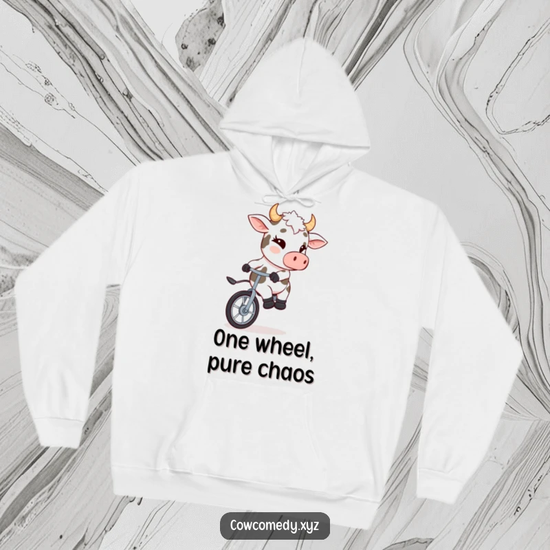 Funny hoodie showing a mischievous cow winking while balancing on a unicycle, ideal for cold days.