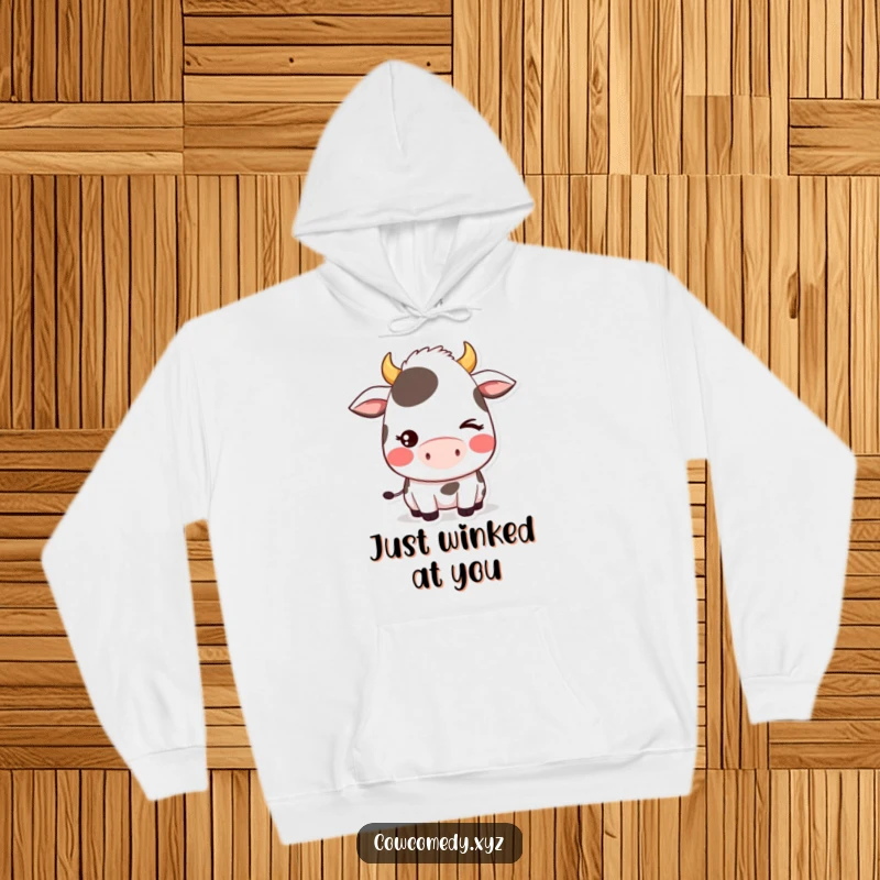 Funny hoodie showcasing a blushing kawaii cow character giving a shy wink, radiating warmth, sweetness, and playful charm.