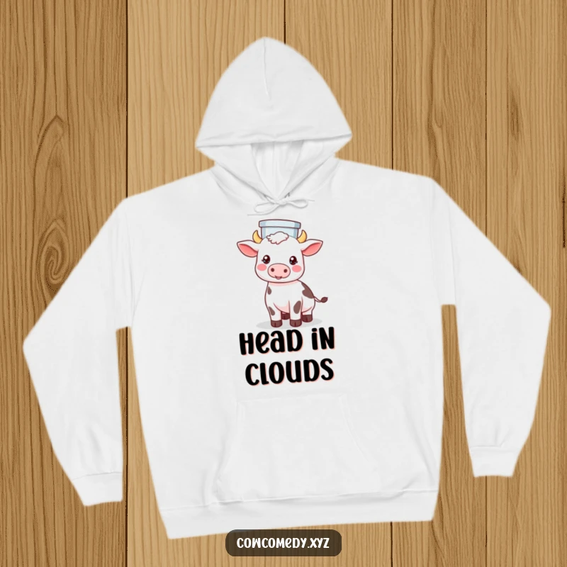 Funny hoodie showing a Kawaii cow skillfully balancing a milk pail on its head with a calm, cheerful expression.