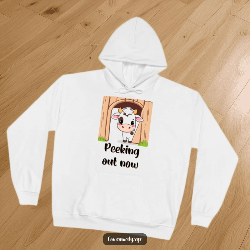 Funny Kawaii Cow Hoodie depicting a cute cartoon cow peeking playfully from behind a barn door, cozy and fun.