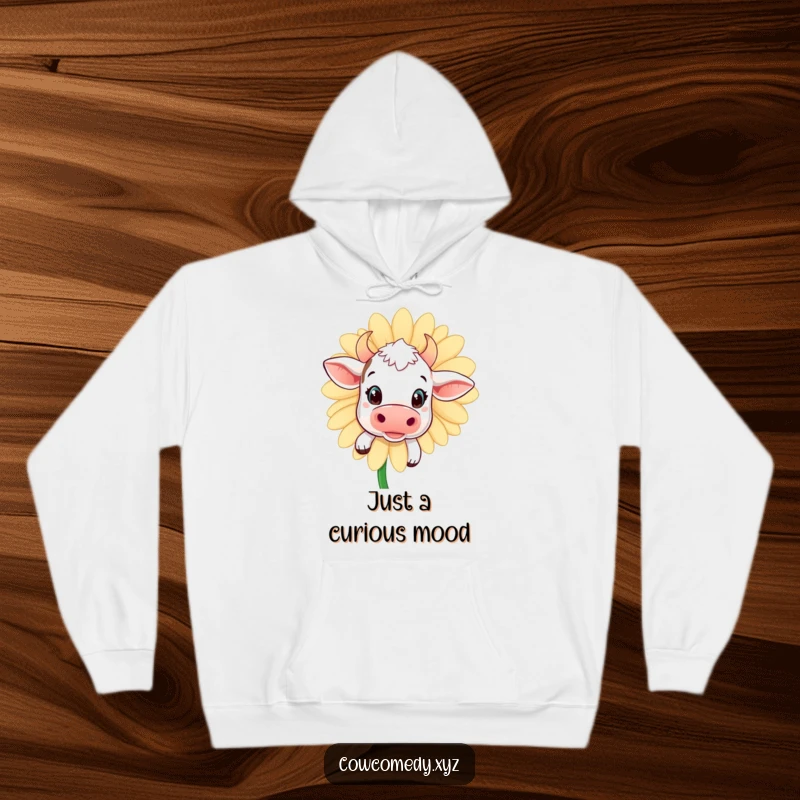 Funny kawaii cow hoodie featuring a curious peek from behind a giant daisy, perfect for warmth and humorous style.