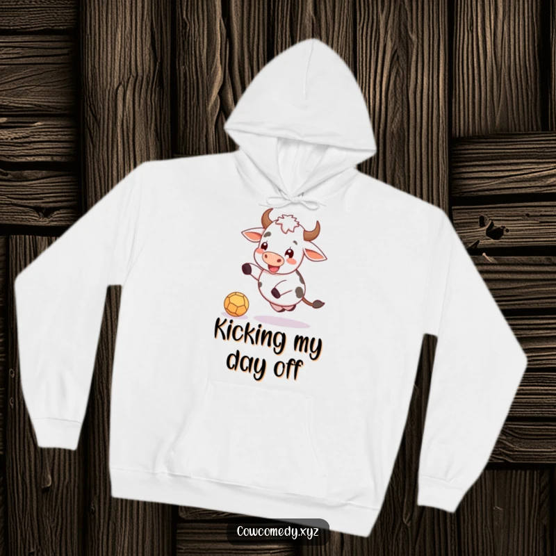 Funny hoodie with a delightful cow kicking a ball with pure glee, suitable for casual wear.