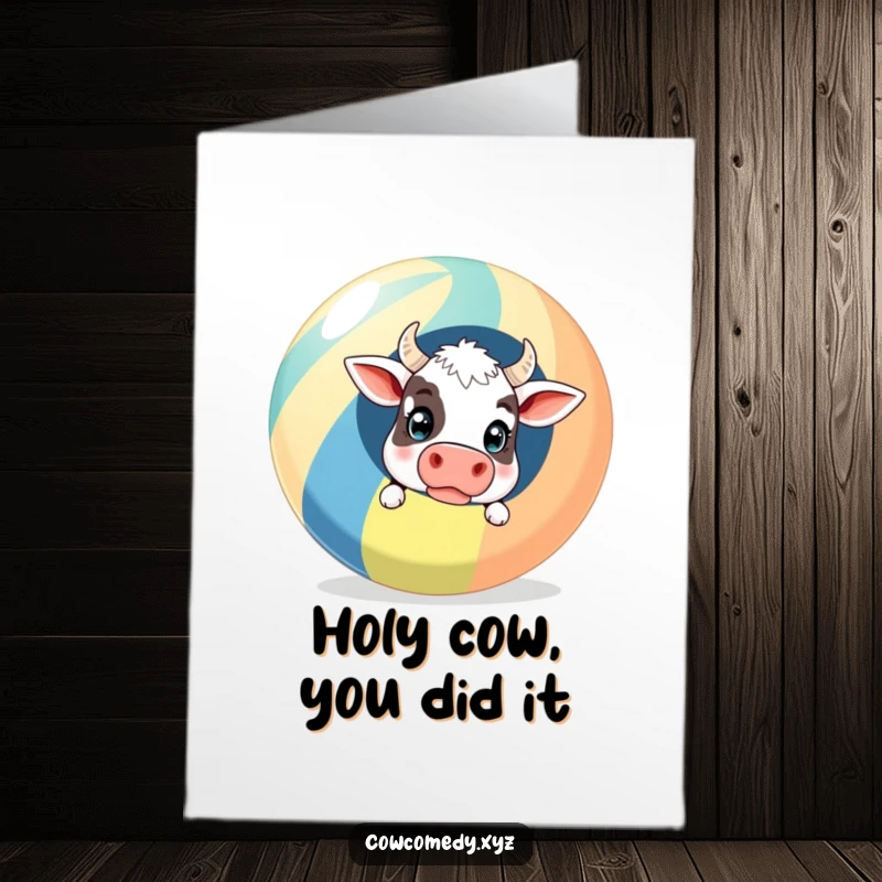 Funny Free Printable Congratulations Card showing a cow's surprised face emerging from behind a large, striped beach ball, full of mirth.