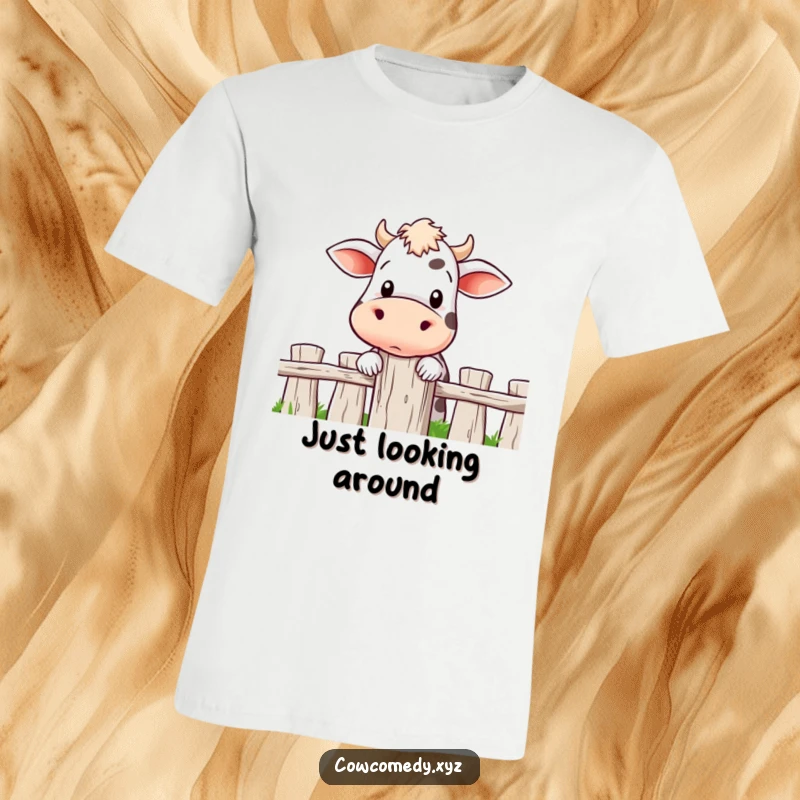 Funny T-shirt depicting a cow with an inquisitive expression, peering over a fence post, capturing a moment of curiosity.