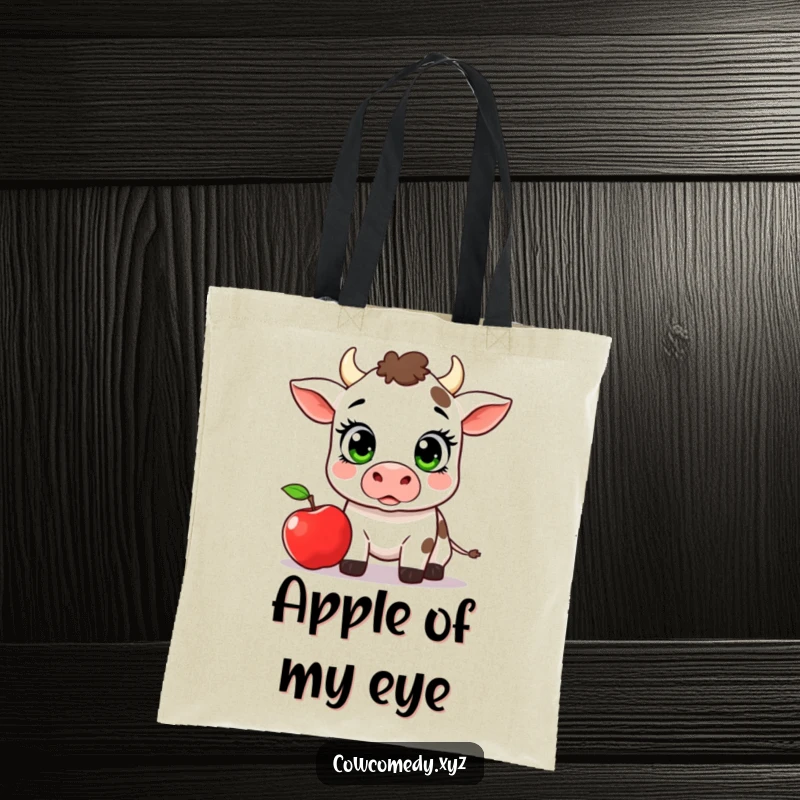Funny Kawaii Cow Tote Bag, surprised cow with wide eyes and a falling apple, humorous and practical.