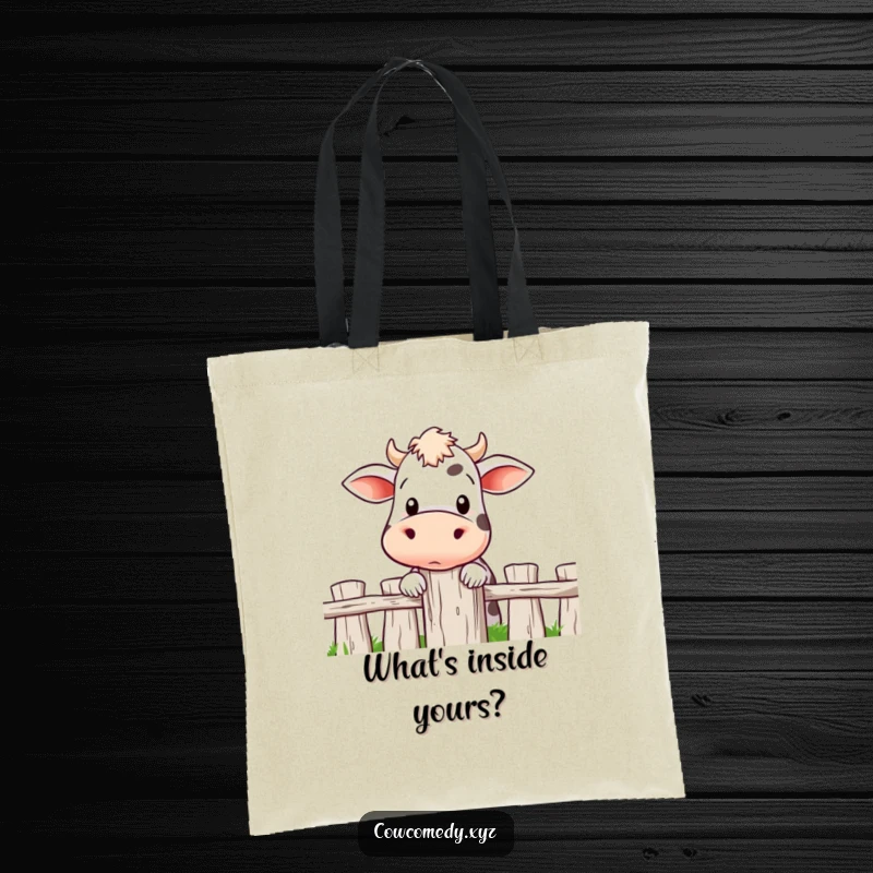 Funny tote bag showing a cow's head peeking over a fence post, with curious eyes and a playful, inquisitive demeanor.